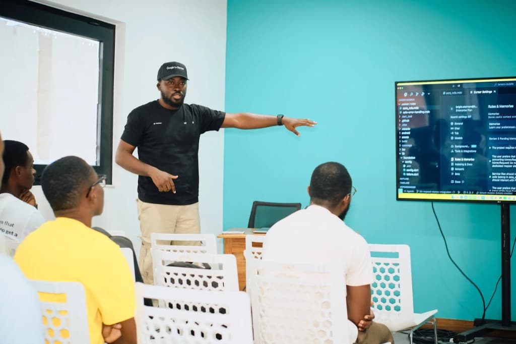 Speaker walking through a Cursor workflow on screen during a community meetup